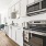 kitchen with ample counter-space and modern appliances and nearness to the a bright dining room