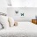made bed in a large bedroom