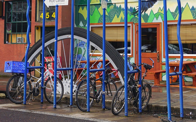 bicycles parked along city sidewalk